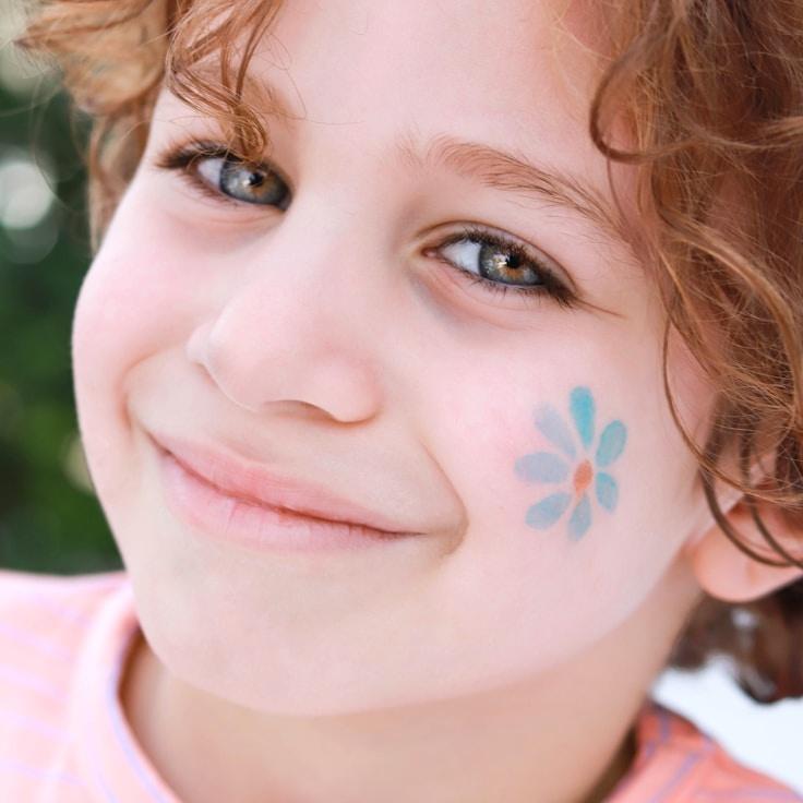 Kaveri Mehta, Lead Design Curator at Open Field Collective, reviewing corporate floral arrangements